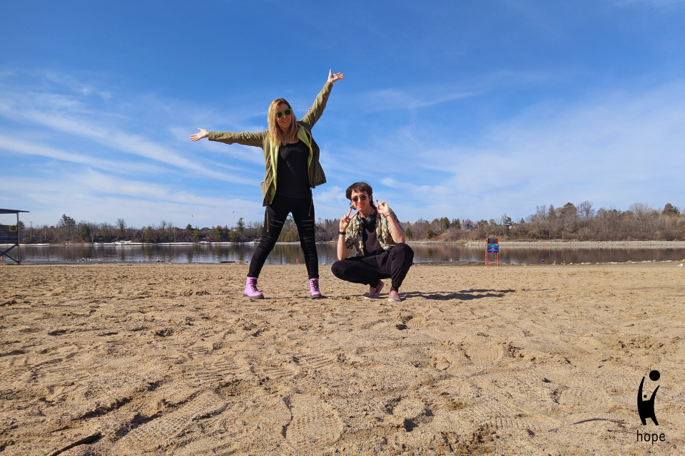 HOPE’s social media team poses on Mooney’s Bay Beach.